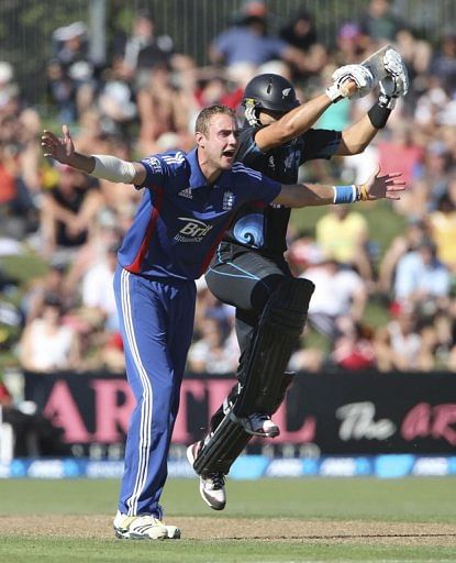 Ross Taylor (R) collides with Stuart Broad during the second one-day international, in Napier, on February 20, 2013